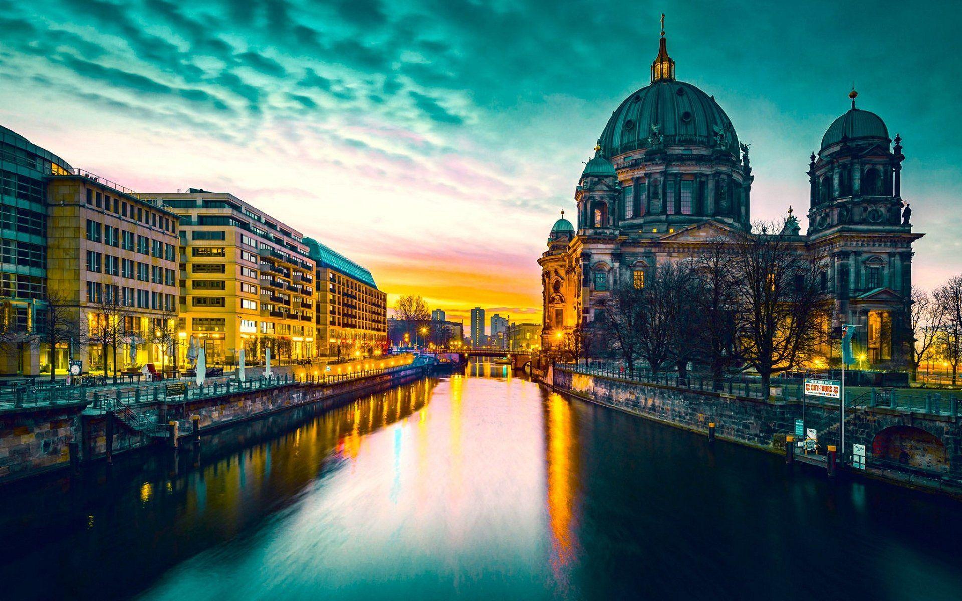 Berlin at dusk, with the cathedral dome above the river