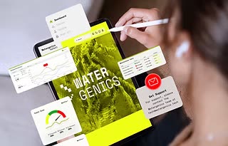 A tablet showing the Watergenics water monitoring dashboard
