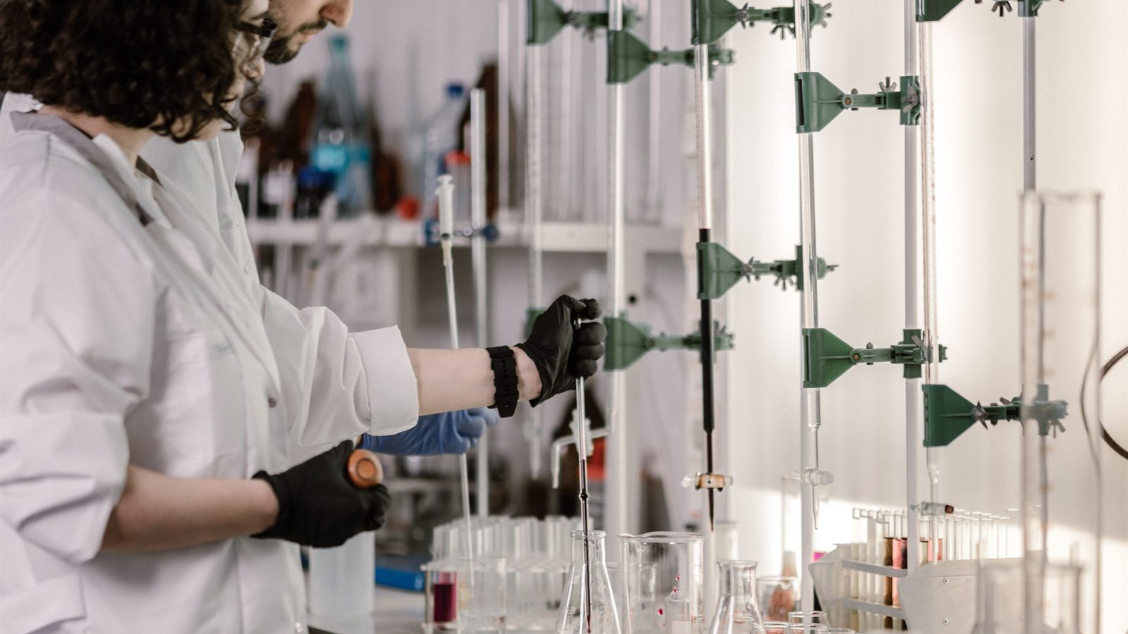 Laboratory glassware being handled during an experiment